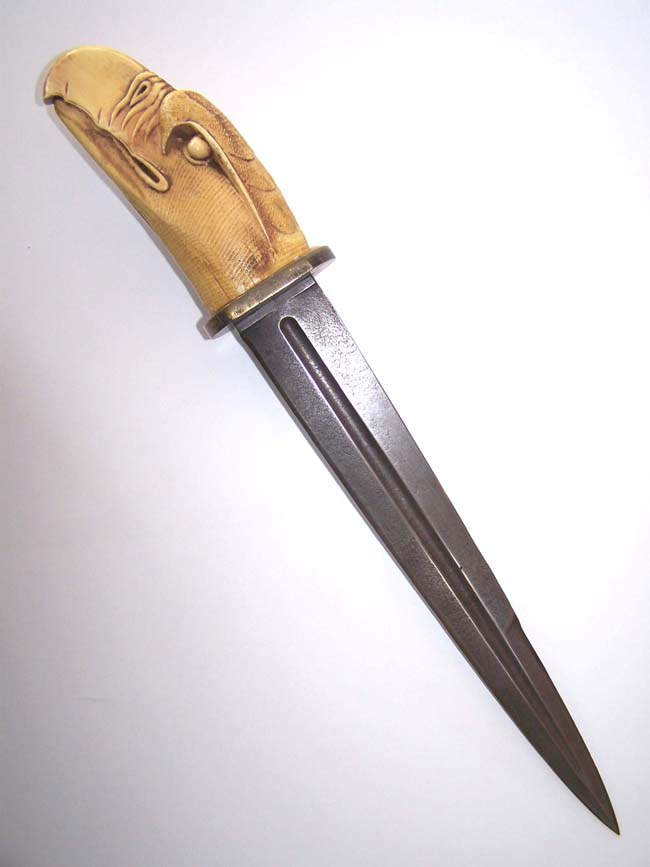 An Antique Knife with a reproduction carved eagle head handle